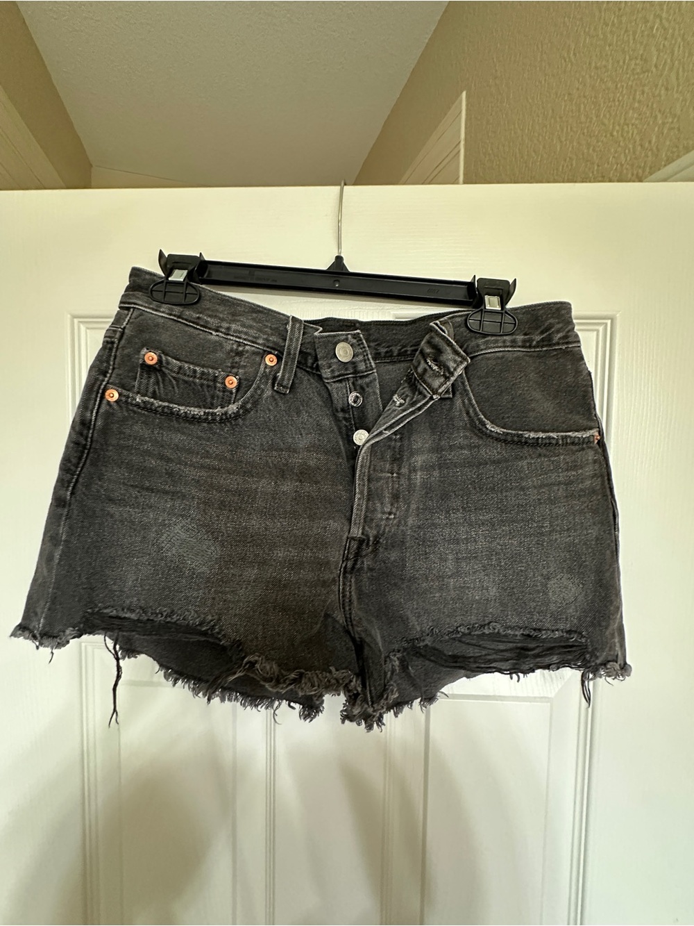 Levi’s Washed Black Denim Cutoff Shorts